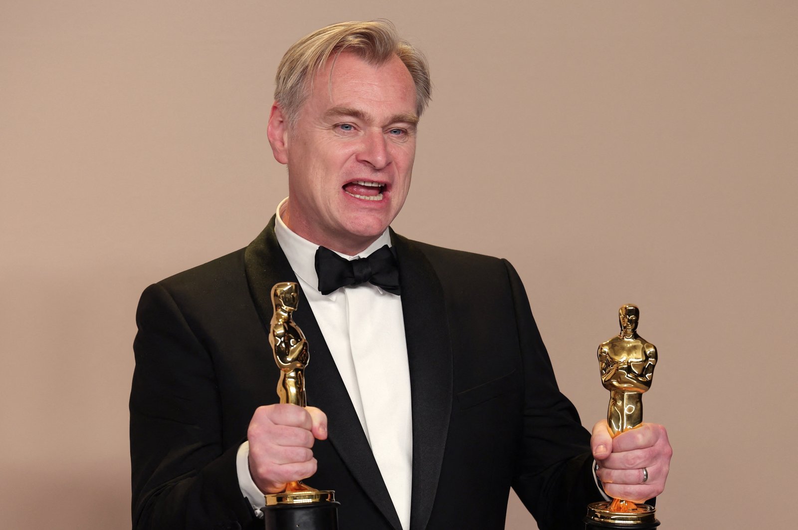 Christopher Nolan poses with the Oscar for Best Picture and Best Director Oscar for &quot;Oppenheimer,&quot; in the Oscars photo room at the 96th Academy Awards in Hollywood, Los Angeles, California, U.S., March 10, 2024. (Reuters Photo)