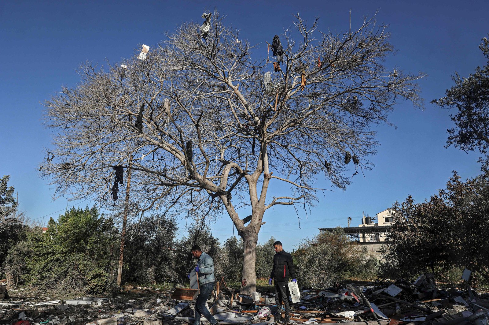 Palestinians search for their belongings after the Israeli bombardment in Rafah in the southern Gaza Strip, Palestine, March 11, 2024. (AFP Photo)
