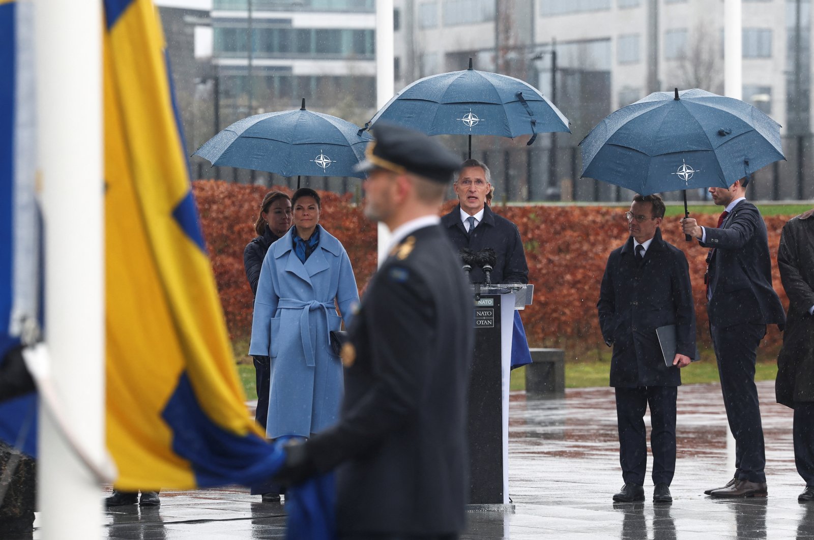 (From L) Sweden's Crown Princess Victoria, NATO Secretary-General Jens Stoltenberg and Swedish Prime Minister Ulf Kristersson attend a flag-raising ceremony at NATO headquarters, in Brussels, Belgium, March 11, 2024. (Reuters Photo)