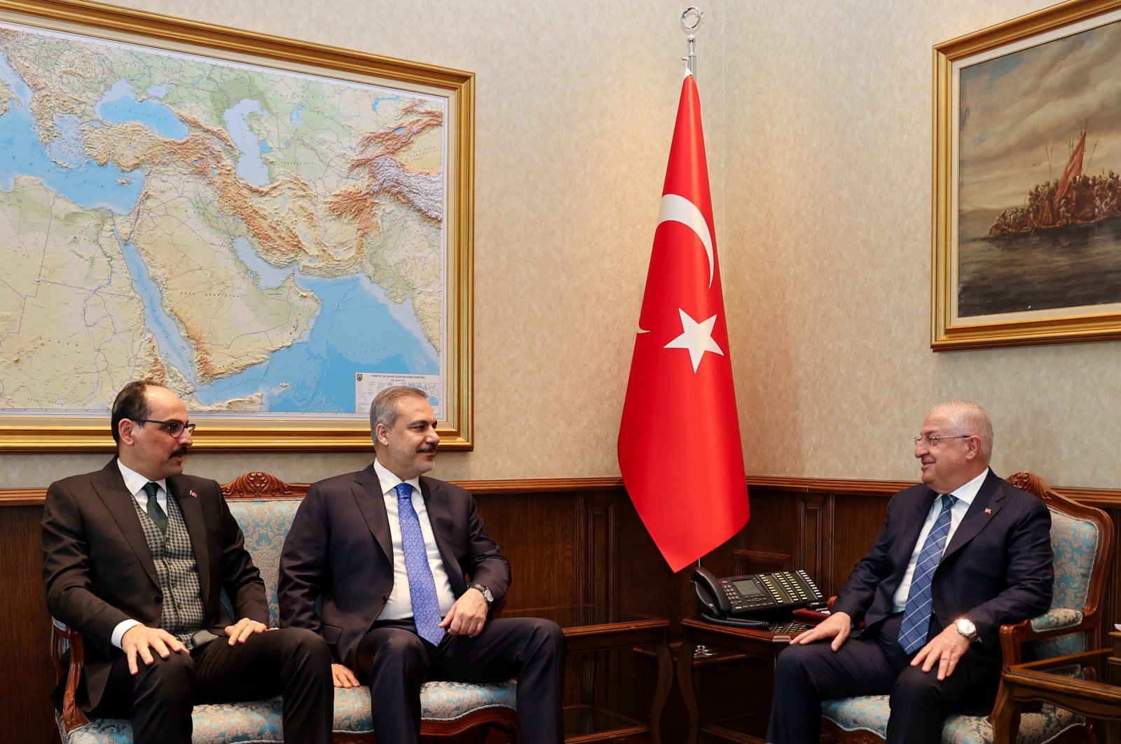 Minister Yaşar Güler (R) hosts Foreign Minister Hakan Fidan (C) and National Intelligence Organization (MIT) chief Ibrahim Kalın in the capital Ankara, Türkiye, March 11, 2024. (AA Photo)