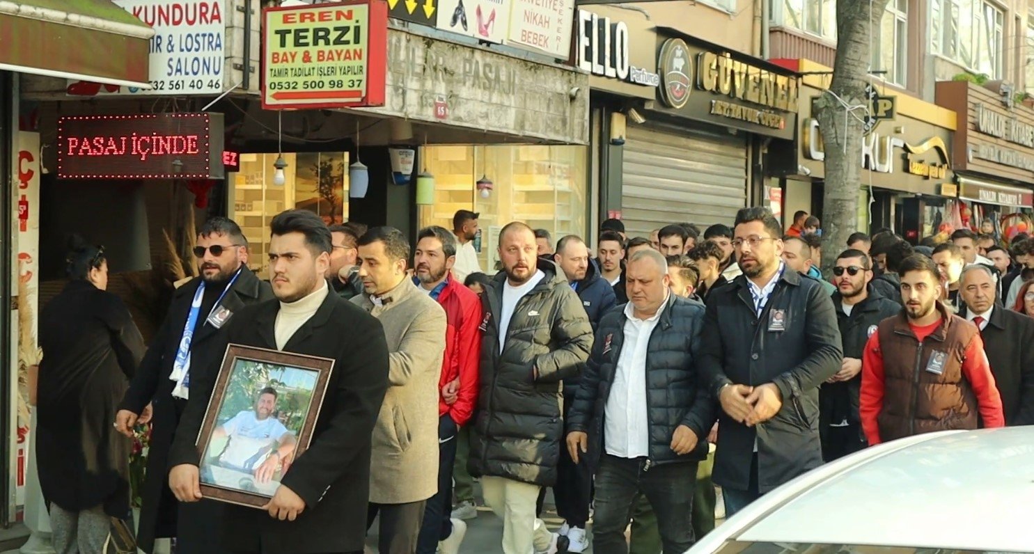 People carrying the photo of Oğuz Aci, the only victim of the accident, attend a walk calling for justice, Istanbul, Türkiye, March 10, 2024. (IHA Photo)