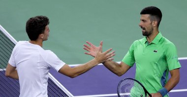 Italy's Luca Nardi is congratulated by Serbia's Novak Djokovic after their match during the BNP Paribas Open at Indian Wells Tennis Garden, Indian Wells, U.S., March 11, 2024. (AFP Photo)