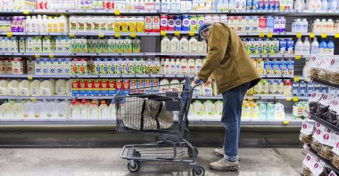 A man shops for dairy products for sale at a grocery store in Bethesda, Maryland, U.S., Feb. 14, 2024. (EPA Photo)