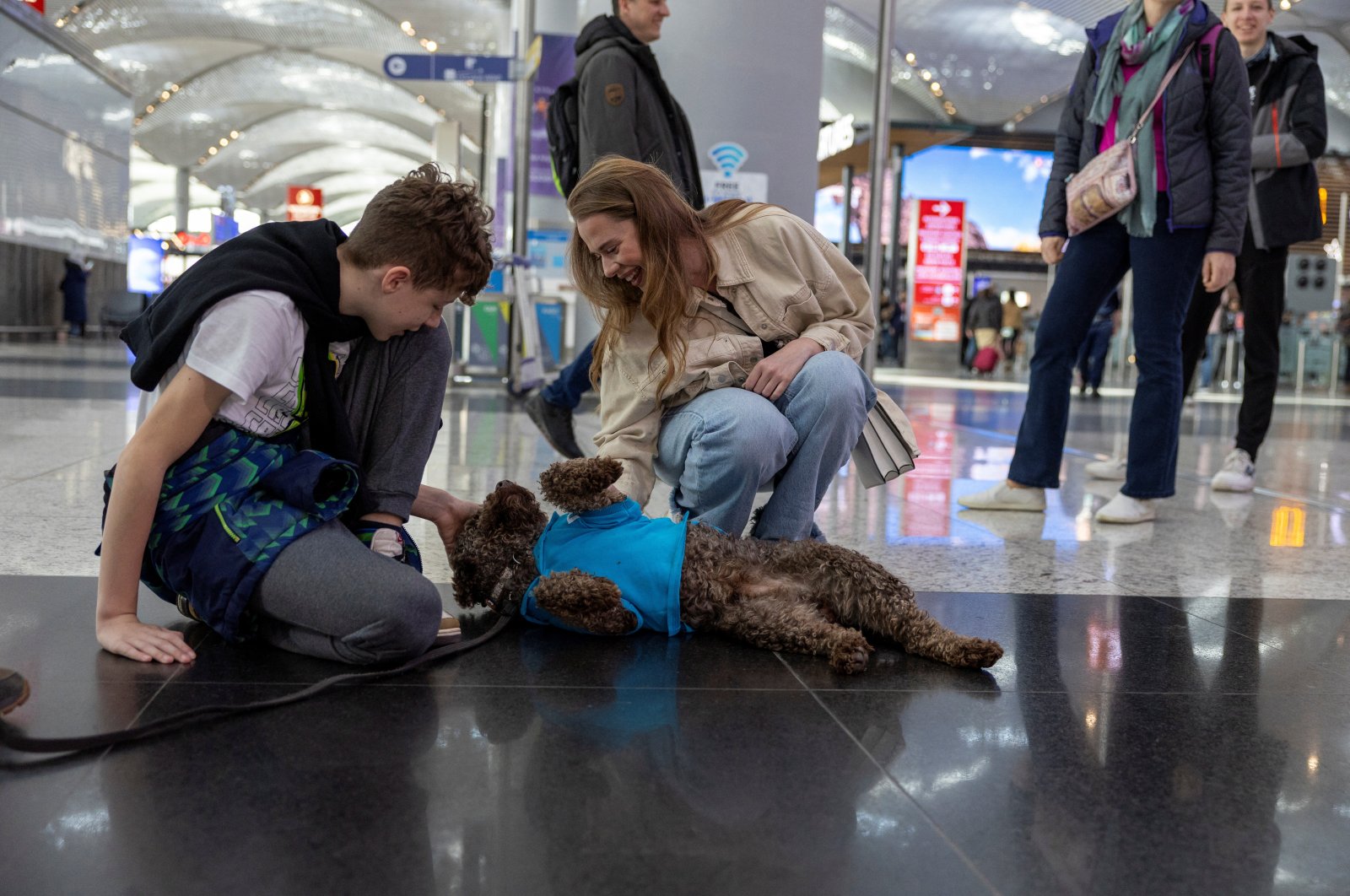 Stressed passengers at Istanbul Airport comforted by roaming therapy dogs, Istanbul, Türkiye, March 11, 2024 (Reuters Photo)