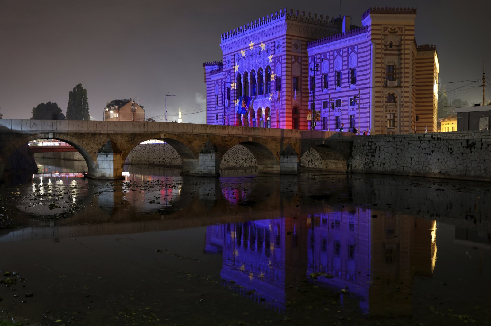 The EU flag is projected on the National Library building in Sarajevo, Bosnia-Herzegovina, Oct. 12, 2022. (AP Photo)