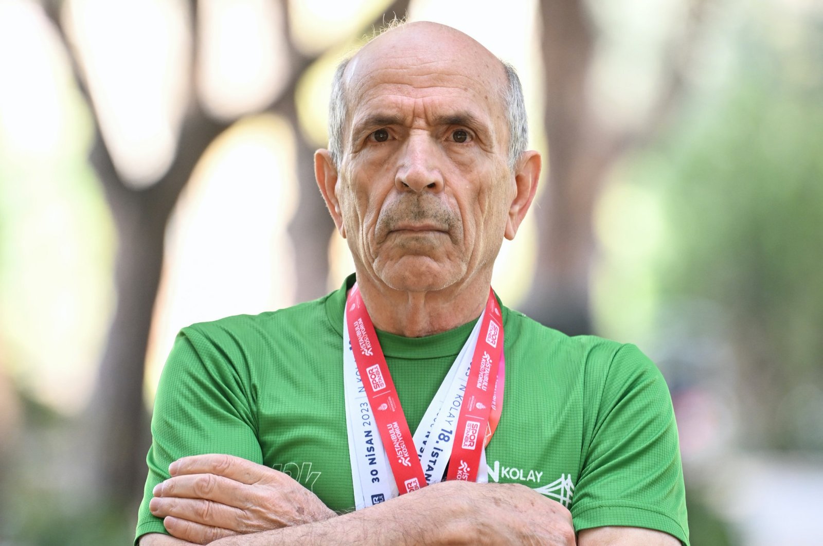 Turkish marathoner Yakup Orhan, 76, poses for a photo after an interview with Anadolu Agency (AA), Istanbul, Türkiye, March 11, 2024. (AA Photo)