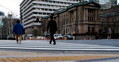 People walk in front of the Bank of Japan (BOJ) building in Tokyo, Japan, Jan. 23, 2024. (Reuters Photo)