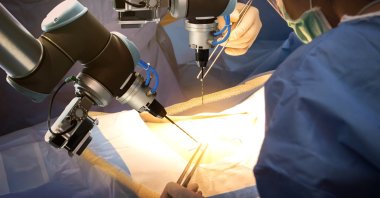 In a futuristic hospital, surgical doctors utilize automated surgical machines in the operating room. (Shutterstock Photo)