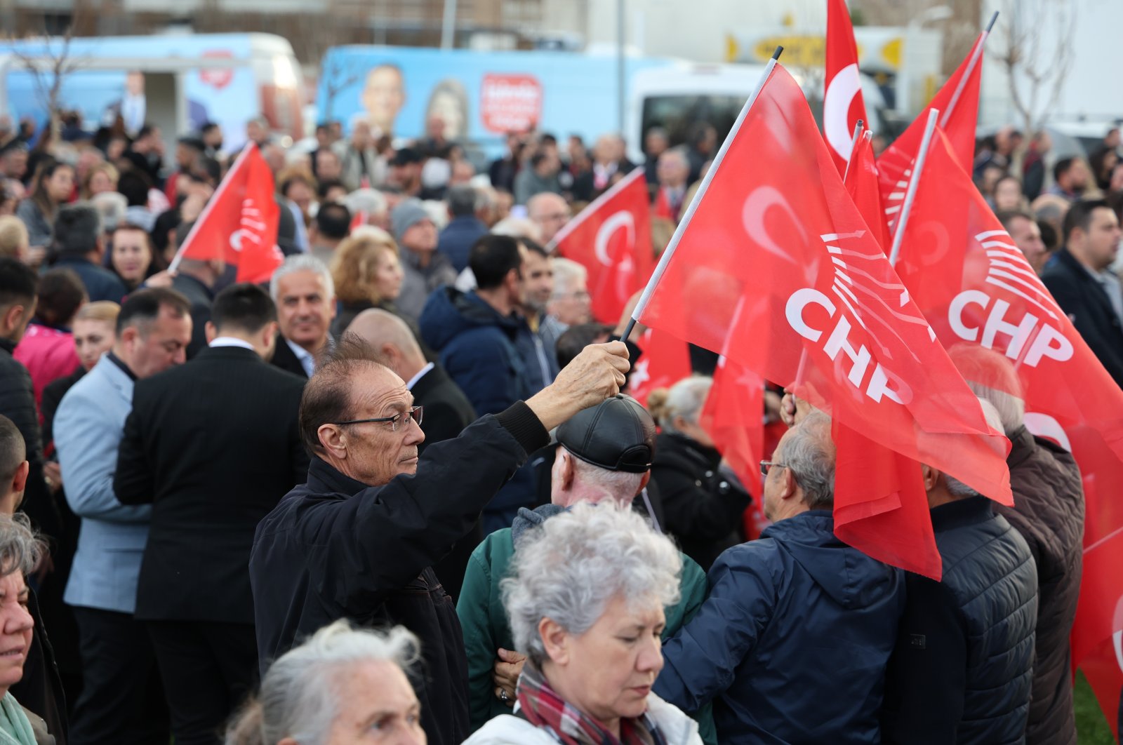 CHP supporters wave party flags at an event in Izmir, western Türkiye, March 12, 2024. (İHA Photo) 