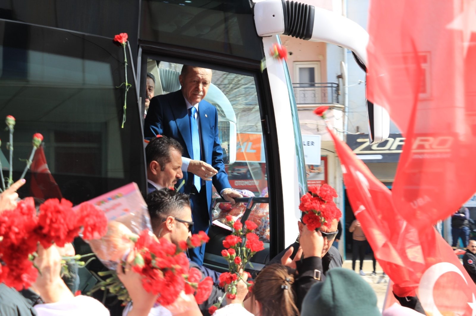 President Recep Tayyip Erdoğan greets supporters from the presidential bus, Şırnak, southeastern Türkiye, March 13, 2024. (İHA Photo)