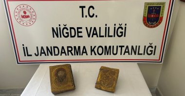Gold-embossed books crafted on deerskin, dating back to the Roman period, seized in Niğde, Türkiye, March 14, 2024. (AA Photo)