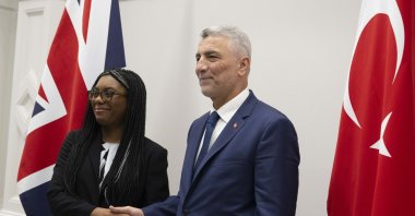 Trade Minister Ömer Bolat shakes hands with U.K. Business and Trade Secretary Kemi Badenoch, London, U.K., March 14, 2024. (AA Photo)