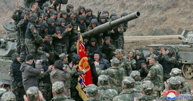 North Korean leader Kim Jong Un (Center) posing with personnel during a training competition between the combined forces of the Korean People&#039;s Army tank crews at an undisclosed location in North Korea, in this picture taken on March 13, 2024, and released by the Korean Central News Agency on March 14. (AFP Photo)