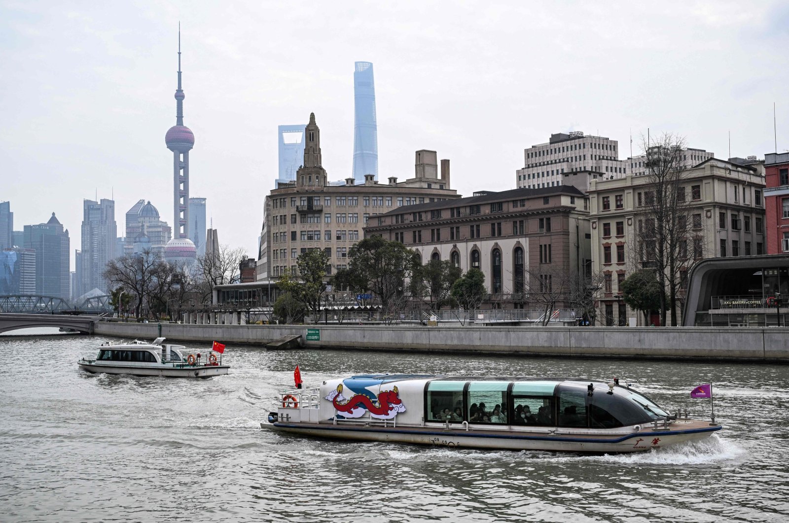 A tourist boat sails on Suzhou River in the Huangpu district in Shanghai, China, March 6, 2024. (AFP Photo)