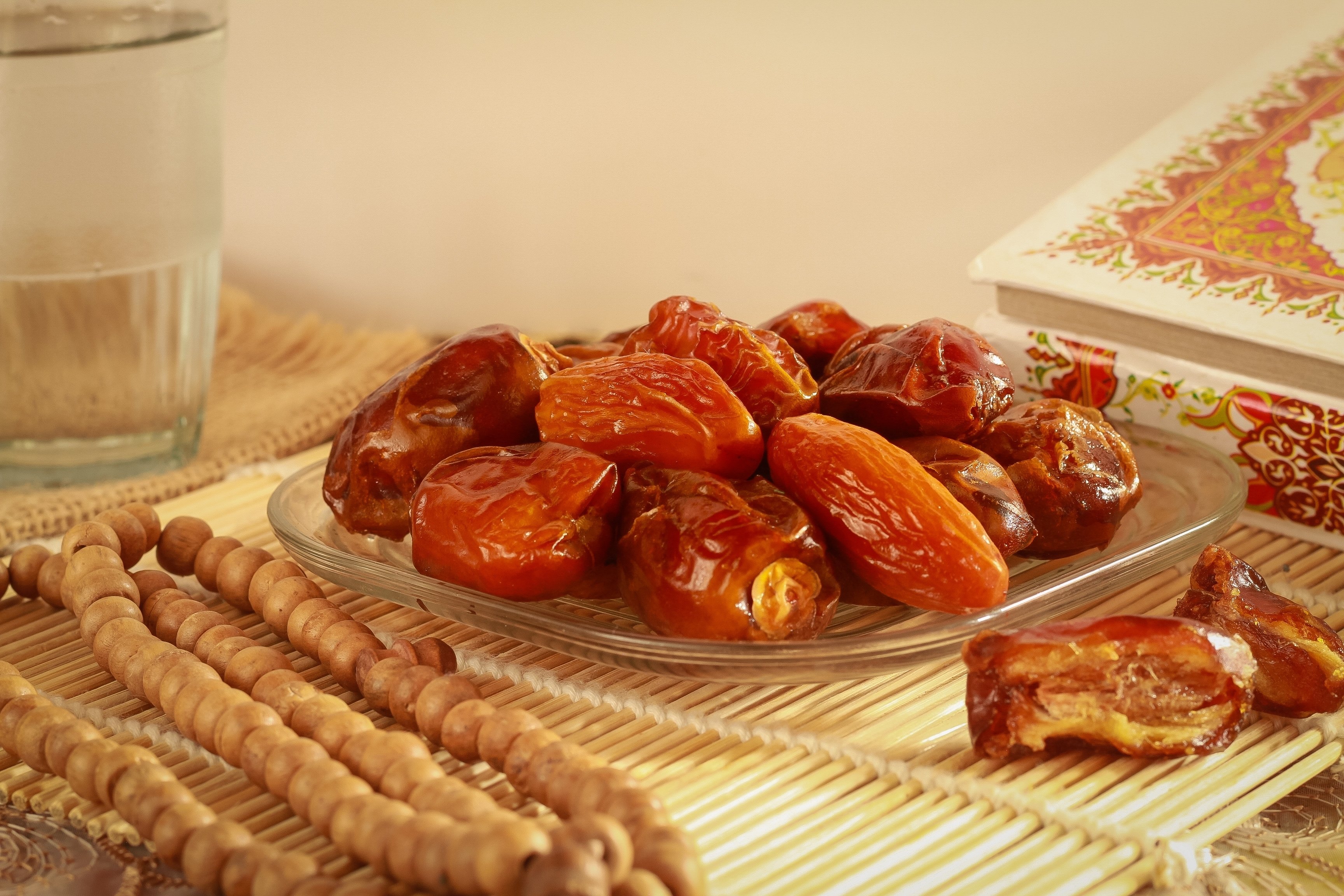 A traditional Ramadan iftar meal often consists of dates paired with a refreshing glass of mineral water. (Shutterstock Photo)