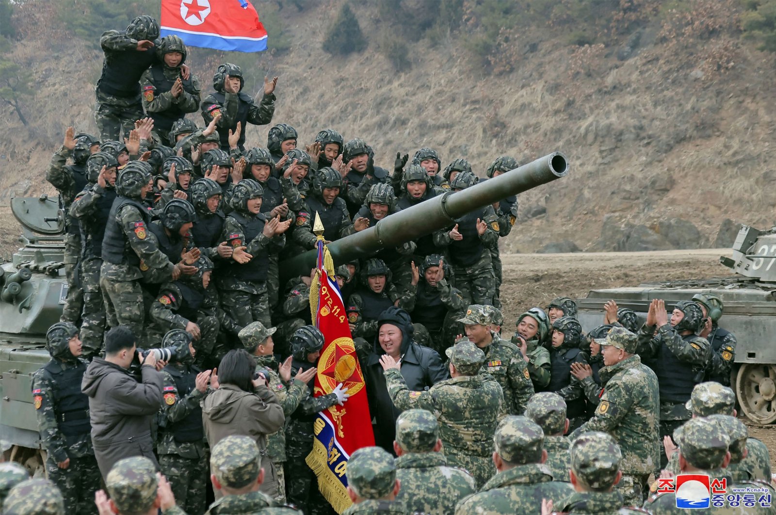 North Korean leader Kim Jong Un (Center) posing with personnel during a training competition between the combined forces of the Korean People&#039;s Army tank crews at an undisclosed location in North Korea, in this picture taken on March 13, 2024, and released by the Korean Central News Agency on March 14. (AFP Photo)
