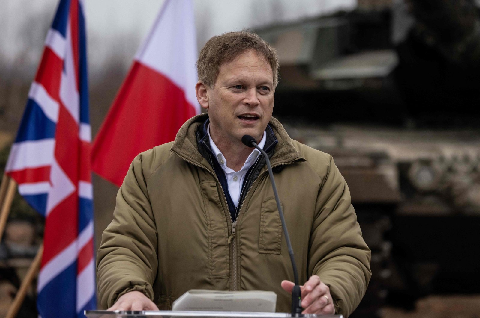 Britain&#039;s Secretary of Defense Grant Shapps speaks during a joint news conference with the Polish defense minister after their meeting on a military training compound next to Orzysz, North-Eastern Poland, on March 13, 2024. (AFP Photo)