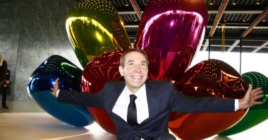 Artist Jeff Koons in front of the sculpture &quot;Tulips&quot; at the presentation of his solo exhibition titled &quot;Jeff Koons. Celebration,&quot; Neue Nationalgalerie, Berlin, Germany, Oct. 29, 2008. (Shutterstock Photo)