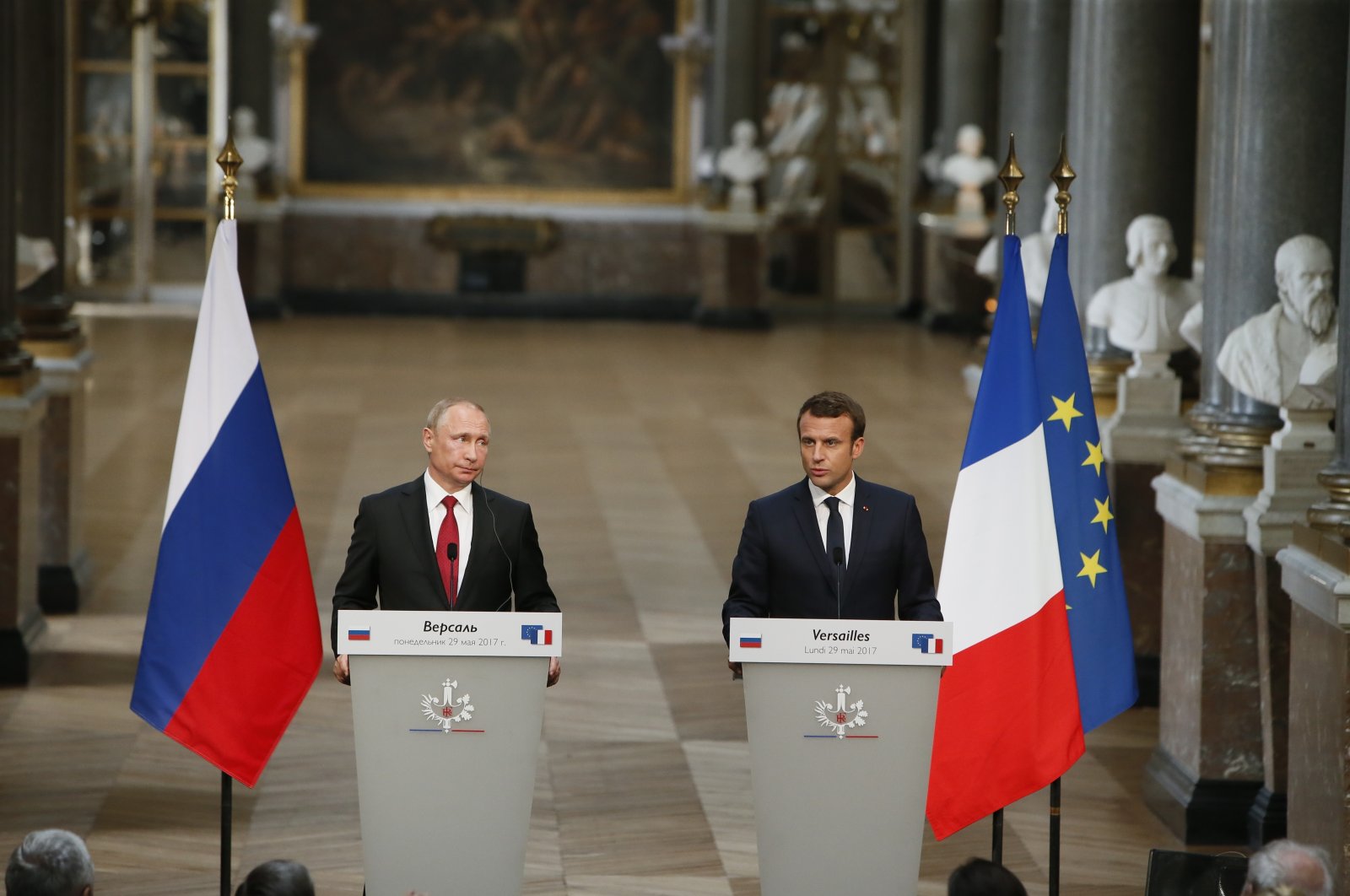 Russian President Vladimir Putin (L) and his French counterpart Emmanuel Macron hold a joint press conference at the Palace of Versailles as they meet for talks before the opening of an exhibition marking 300 years of diplomatic ties between the two countries, in Versailles, near Paris, France, May 29, 2017. (AP File Photo)