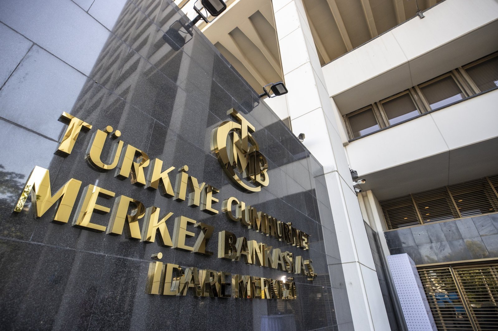 The logo of the Central Bank of the Republic of Türkiye (CBRT) is seen at the entrance of the bank&#039;s headquarters, Ankara, Türkiye, July 28, 2022. (AA Photo)