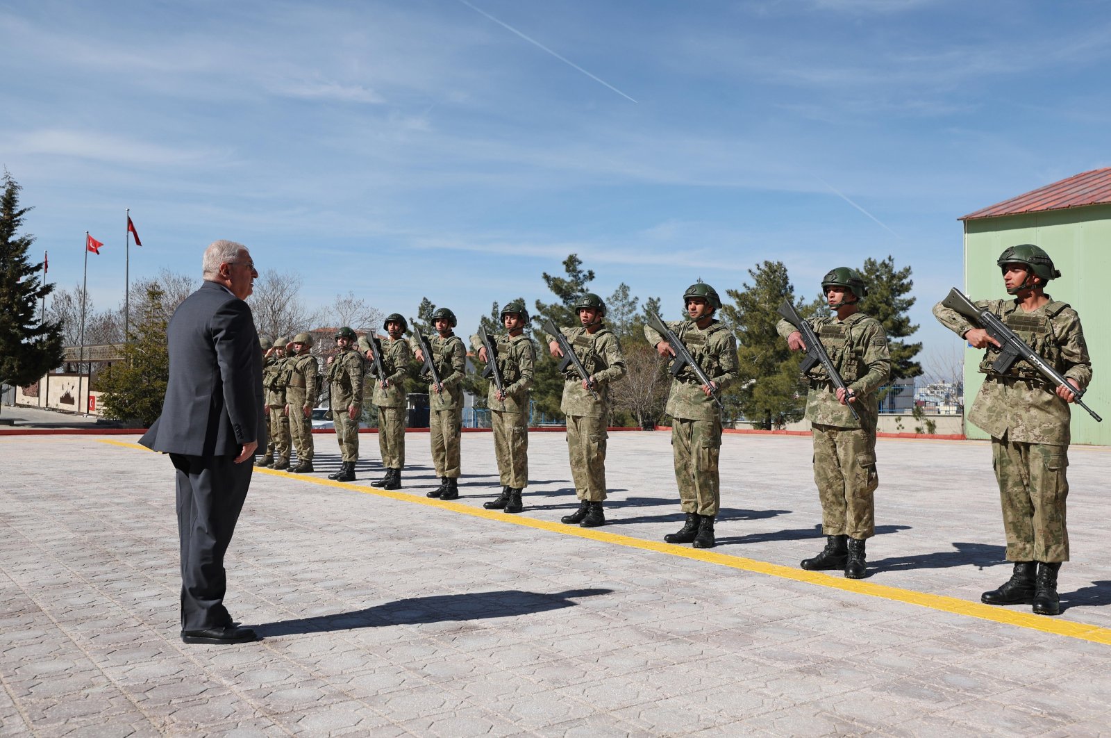 Defense Minister Yaşar Güler salutes the soldiers at a military base near the border with Iraq, Şırnak, southeastern Türkiye, March 13, 2024. (AA Photo)