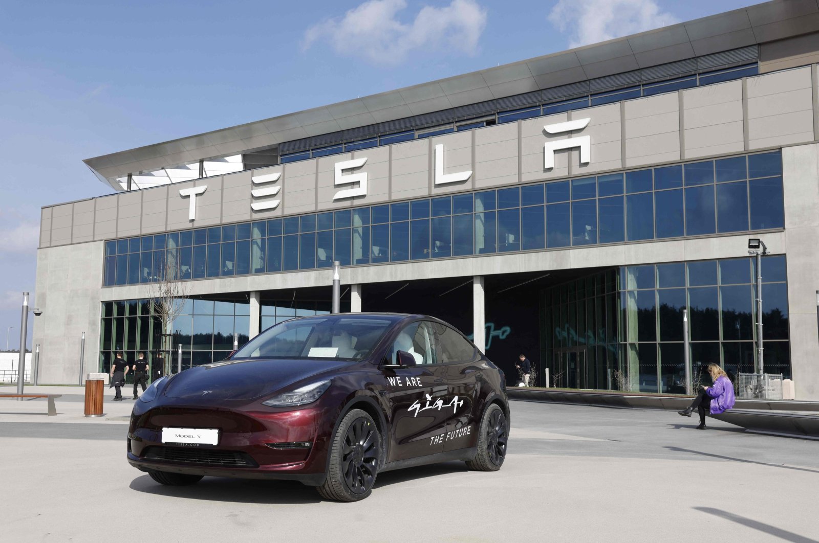 A Tesla Model Y car is parked in front of the company&#039;s plant as Tesla CEO Elon Musk visits the company&#039;s electric car plant in Gruenheide near Berlin, Germany, March 13, 2024. (AFP Photo)