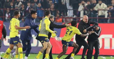 A Trabzonspor fan (R) attacks Fenerbahçe players after the Süper Lig match, Trabzon, Türkiye, March 17, 2024. (EPA Photo)