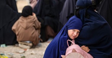 A girl hugs her mother at the al-Hol camp, in northeastern al-Hassakeh Governorate, Syria, Oct. 11, 2023. (AFP Photo)