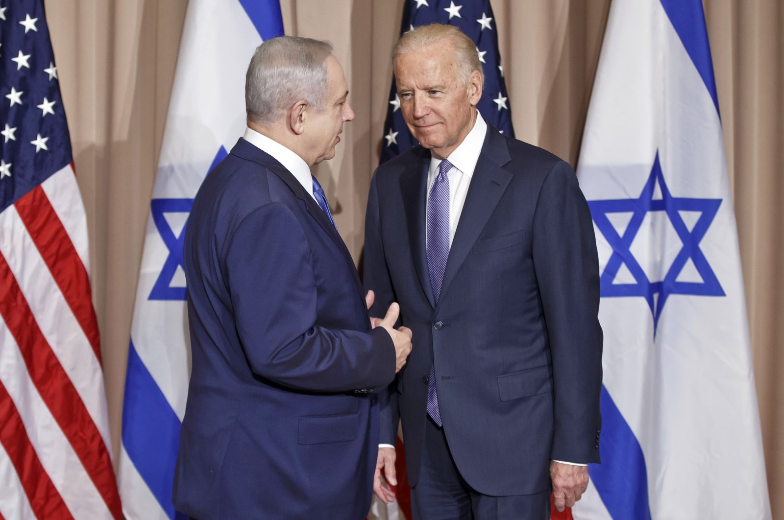 Israeli Prime Minister Benjamin Netanyahu, left, and then-U.S. Vice-President Joe Biden pose for the media prior to a meeting on the sidelines of the World Economic Forum in Davos, Switzerland, Thursday, Jan. 21, 2016. (AP File Photo)