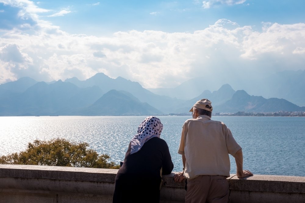 An old couple enjoys the sea scenery, Antalya, Türkiye, March 19, 2024. (Shutterstock Photo)