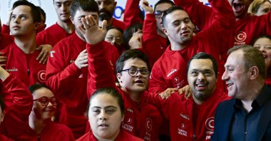 Turkish athletes with Down syndrome pose for a photo with the president of the Turkish Special Athletes Sports Federation (TÖSSFED), Birol Aydın, Ankara, Türkiye, March 7, 2024. (AA Photo)