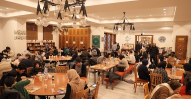 Japanese Muslims and non-Muslims break the fast at the traditional iftar program at Tokyo Mosque, Tokyo, Japan, March 18, 2024. (IHA Photo)