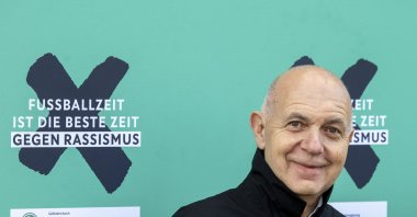 German Football Federation (DFB) President Bernd Neuendorf stands next to the campaign motto &quot;Football time is the best time against racism&quot; at the launch of the DFB&#039;s anti-racism campaign, Berlin, Germany, March 18, 2024. (AP Photo)