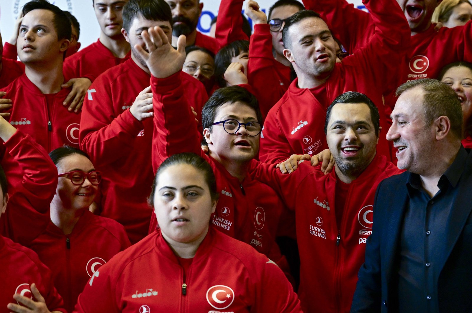 Turkish athletes with Down syndrome pose for a photo with the president of the Turkish Special Athletes Sports Federation (TÖSSFED), Birol Aydın, Ankara, Türkiye, March 7, 2024. (AA Photo)