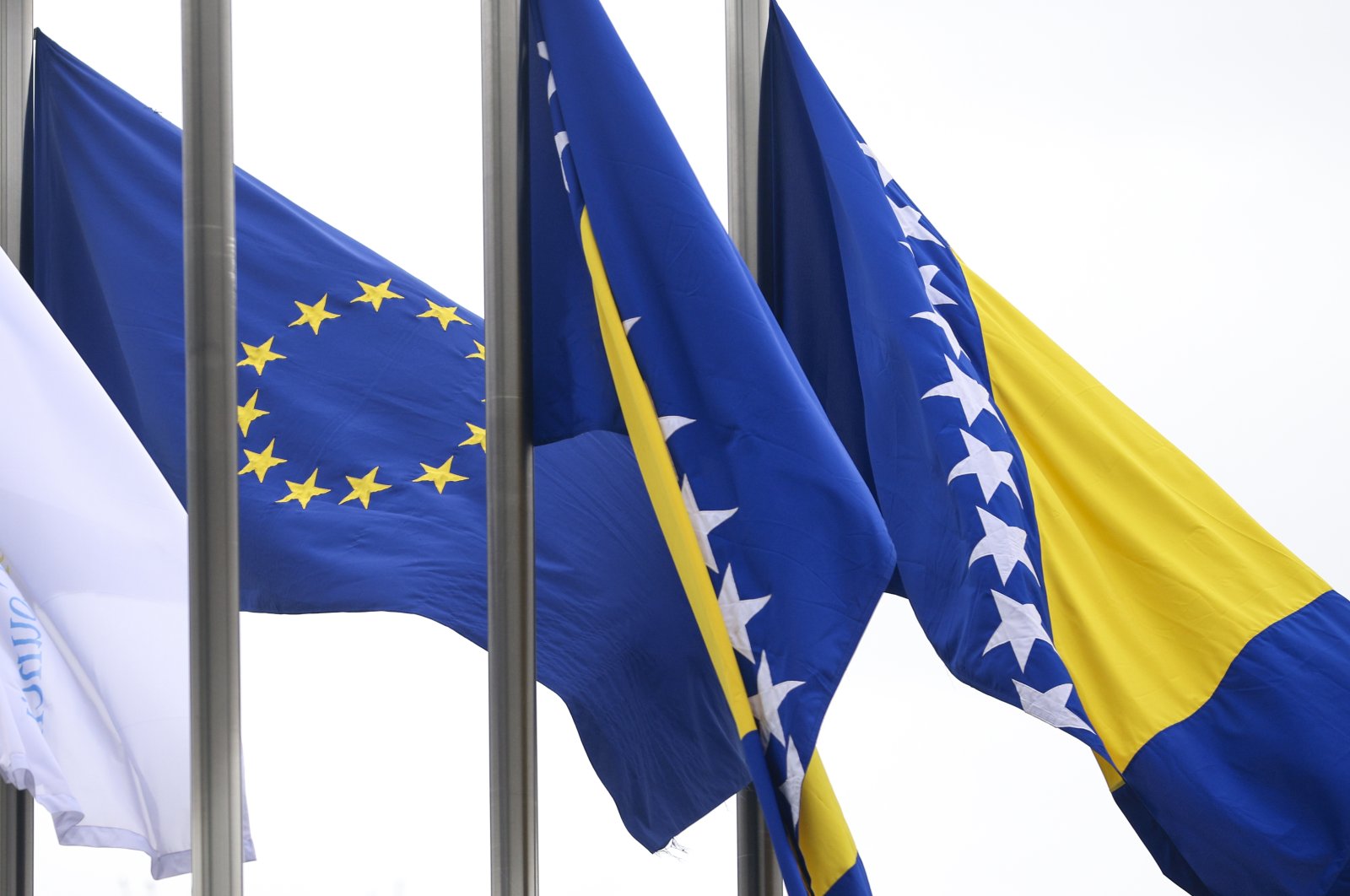 EU flag flutters next to the flag of Bosnia-Herzegovina in Sarajevo, Bosnia-Herzegovina, March 12, 2024. (AP Photo)
