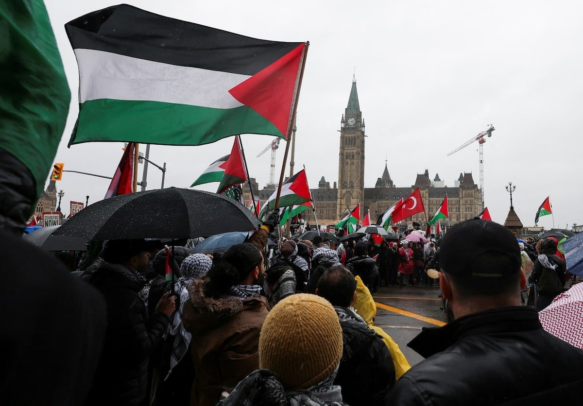 Protesters hold Palestinian flags during a rally to call for a cease-fire in Gaza, on Parliament Hill in Ottawa, Ontario, Canada, March 9, 2024. (Reuters Photo)