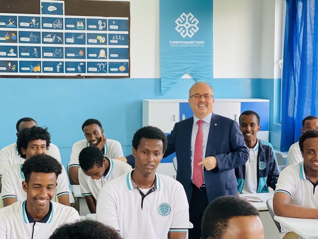 TMV President Dr. Birol Akgün poses with students at the Maarif school in Mogadishu, in this photo released on March 20, 2024. (AA Photo)