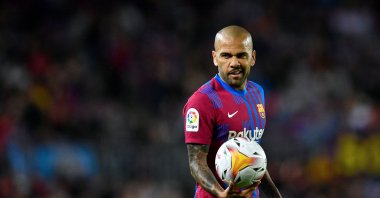 Former Barcelona defender Dani Alves holds the ball during the Spanish League football match against Mallorca, Camp Nou stadium, Barcelona, Spain, May 1, 2022. (AFP Photo)