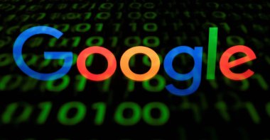 This illustration picture shows the Google logo displayed on a screen and reflected on a tablet in Pari, France, April 29, 2018. (AFP Photo)