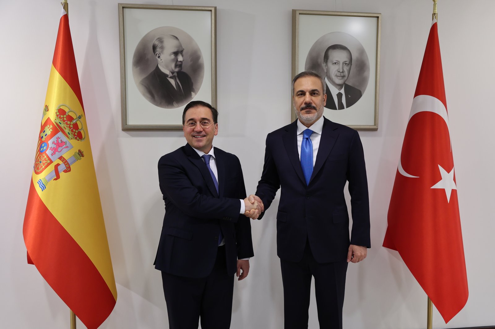 Foreign Minister Hakan Fidan and his Spanish counterpart Jose Manuel Albares shake hands after meeting in Ankara, March 20, 2024. (AA Photo)