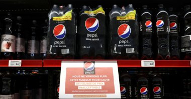 A sign reading &quot;We are no longer selling this brand due to unacceptable price increases. We apologize for the inconvenience caused&quot; is seen on a shelf for PepsiCo product Pepsi at a Carrefour hypermarket, Paris, France, Jan. 4, 2024. (Reuters Photo)