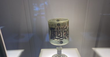 Visitors show great interest in the unique Mamluk lamp, alongside Turkish glassware, at the Beykoz Glass and Crystal Museum, Istanbul, Türkiye, March 21, 2024. (IHA Photo)