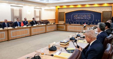 Iraq&#039;s foreign minister Fuad Hussein and other officials (R) meet with a visiting Turkish delegation headed by Foreign Minister Hakan Fidan (2nd L) in Baghdad, Iraq, March 14, 2024. (AFP Photo)