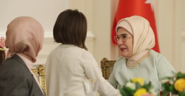 First lady Emine Erdoğan chats with a girl during an iftar event, Ankara, Türkiye, March 21, 2024. (AA Photo)