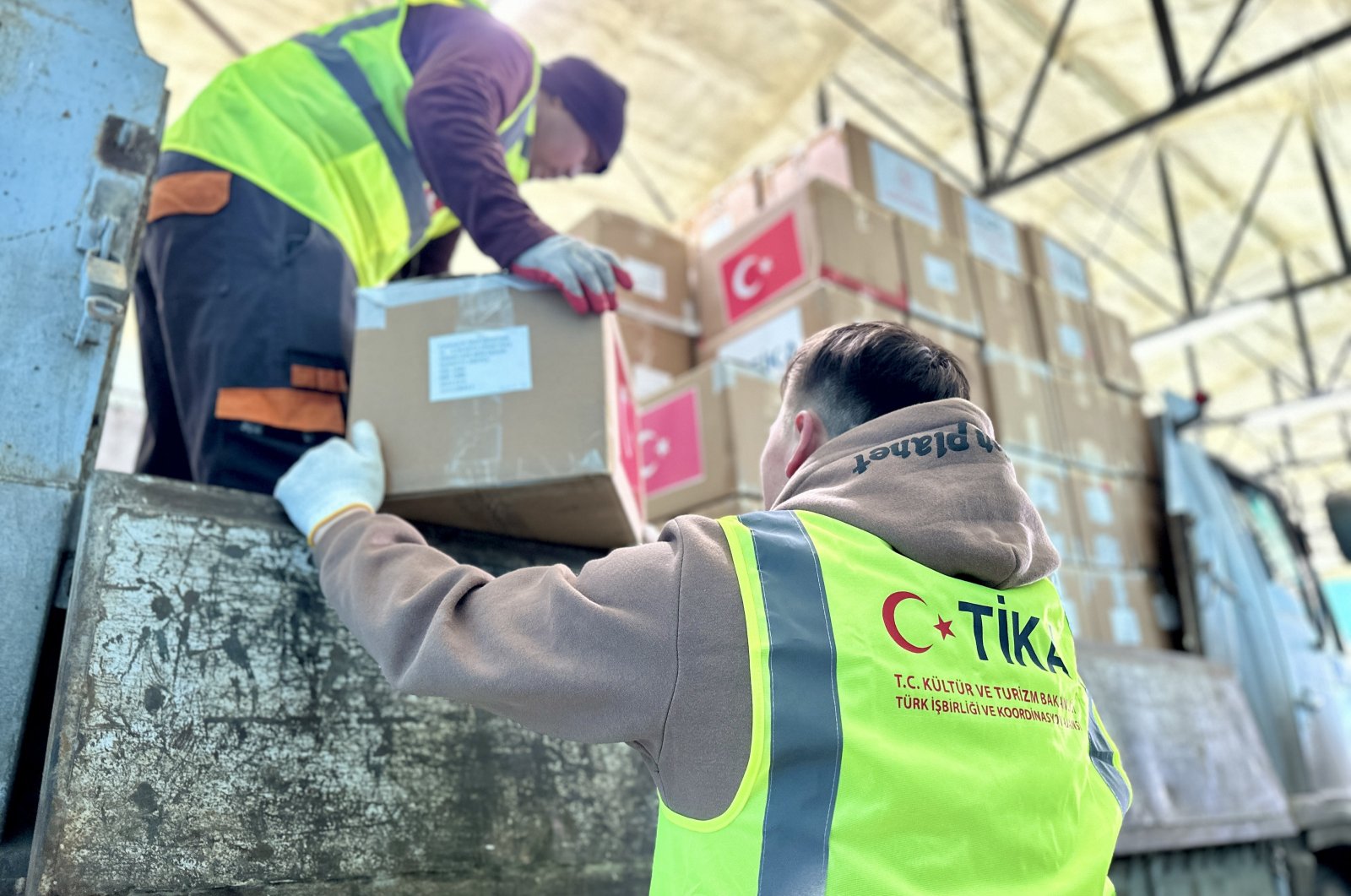 An undated photo of Turkish Cooperation and Coordination Agency (TIKA) volunteers seen delivering aid packages. (AA Photo)