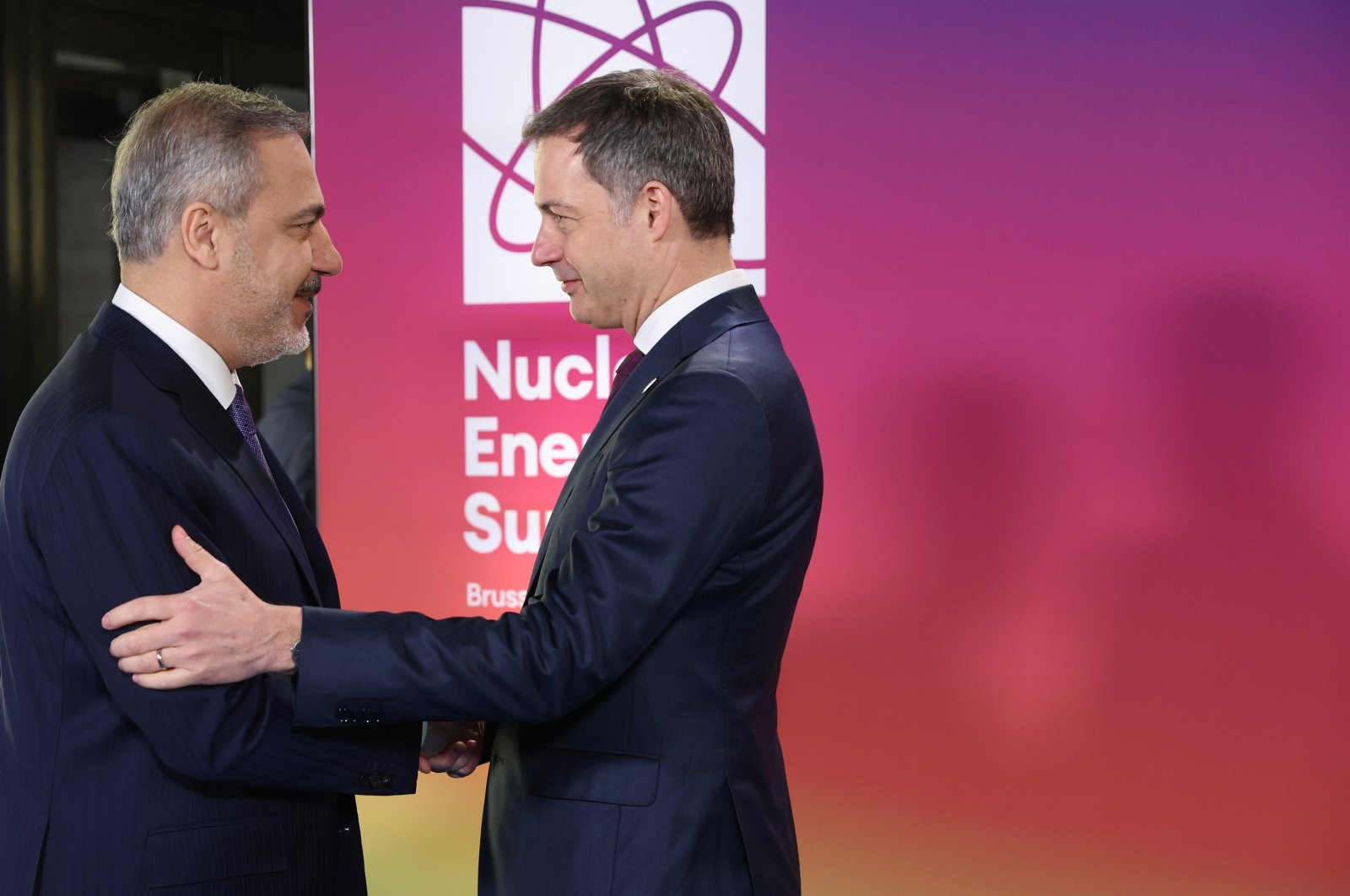Foreign Minister Hakan Fidan (L) is welcomed by Belgian Prime Minister Alexander De Croo (R) prior to the Nuclear Energy Summit in Brussels, Belgium, March 21, 2024. (EPA Photo)