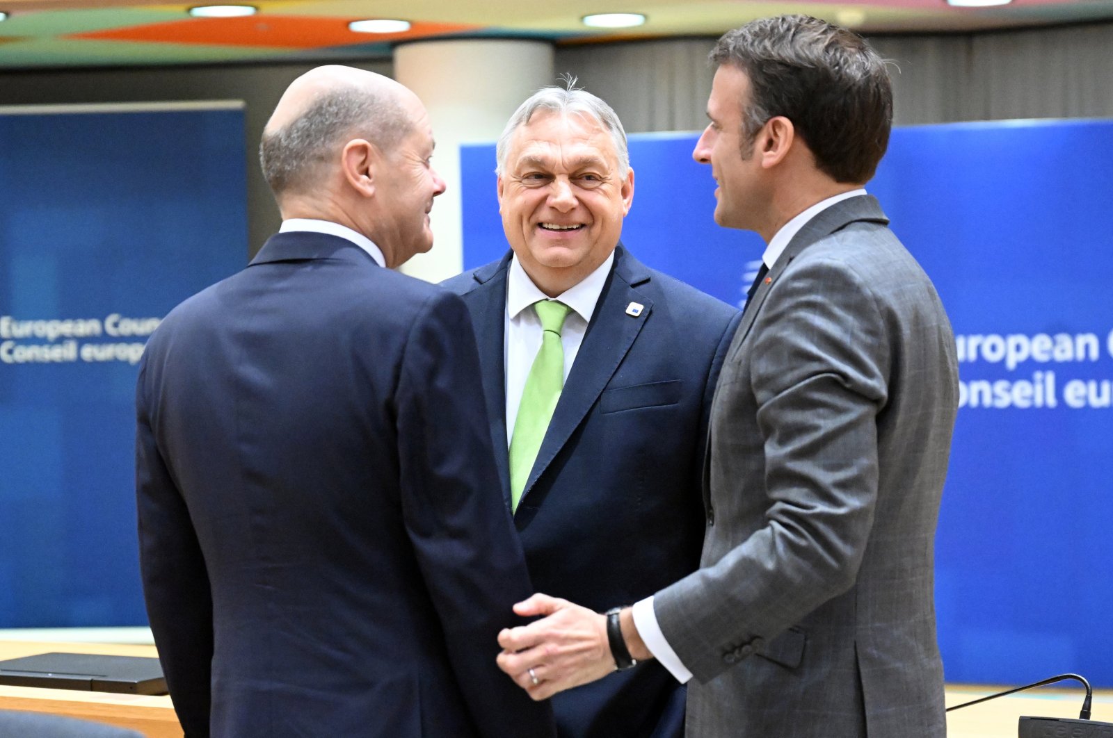 German Federal Chancellor Olaf Scholz (L), Hungarian Prime Minister Viktor Orban (C) and French President Emmanuel Macron converse during a European Council meeting, Brussels, Belgium, March 21, 2024.
