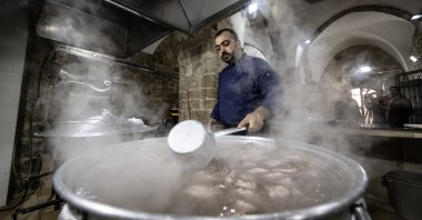 A staff member cooks a meal as part of the Ramadan aid efforts at the Haseki Sultan Lodge, Jerusalem, Palestine, March 21, 2024. (AA Photo)