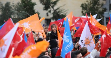 People waving Justice and Development Party (AK Party) and Turkish flags during a rally by President Recep Tayyip Erdoğan, Kilis, Türkiye, March 21, 2024. (İHA Photo)