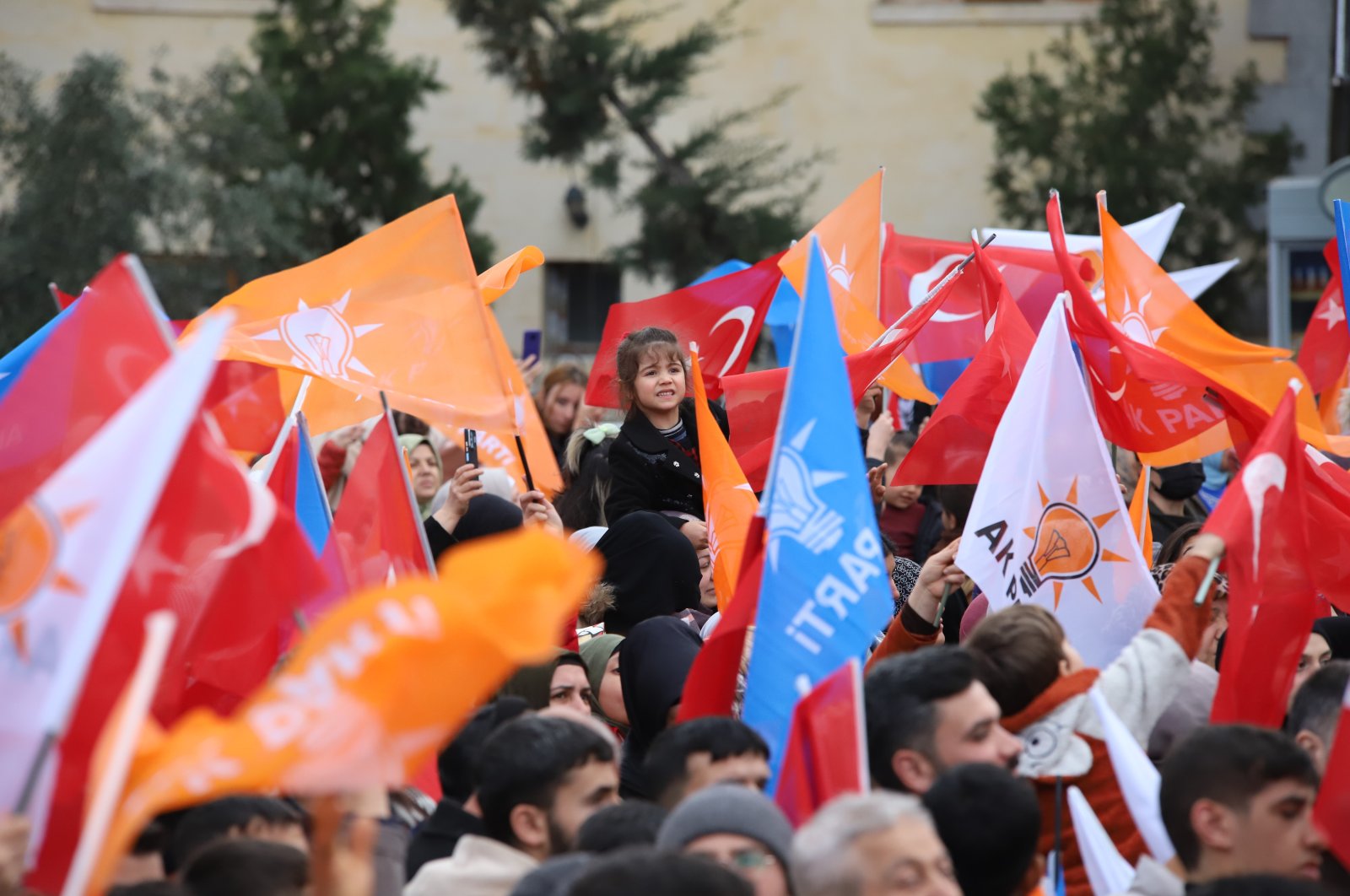 People waving Justice and Development Party (AK Party) and Turkish flags during a rally by President Recep Tayyip Erdoğan, Kilis, Türkiye, March 21, 2024. (İHA Photo)